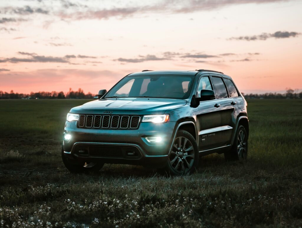 A Jeep Cherokee parked in a field during sunset.
Photo by Kirk Thornton from Unsplash