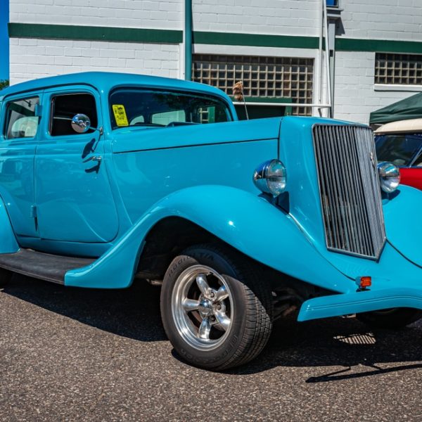 Close-up of a blue vintage car's front grill