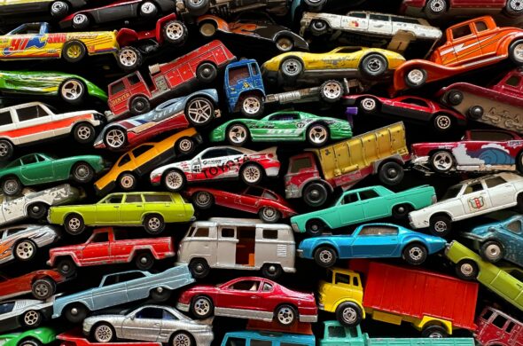 A series of different colored cars, trucks, and vans Photo by _Wokandapixels from Pexels