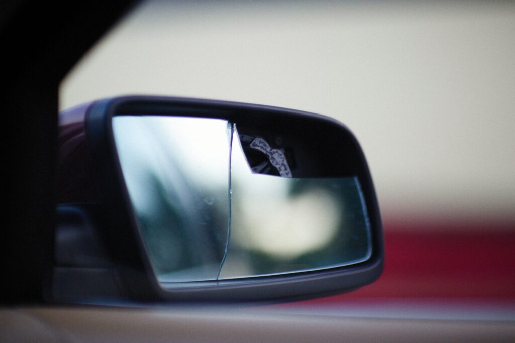 A broken side mirror on a car.
Photo by Alexey Demidov from Pexels.