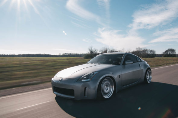 car driving on a sunny road
