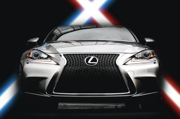 A photo featuring a silver-grey Lexus IS with a striking neon blue and red background, set against a black backdrop