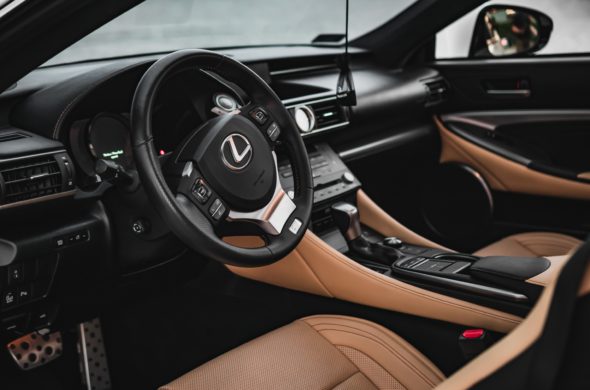 A photo of Lexus car with black and brown interior focusing on front seat view