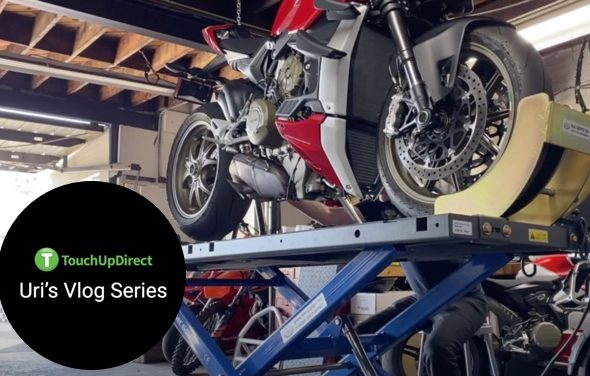 A snippet Ducati Streetfighter V4 elavated for upgrade in a motor shop intended for Uri's Vlog Series
