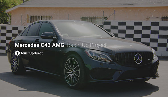A picture of black mercedes C43 AMG parked outside