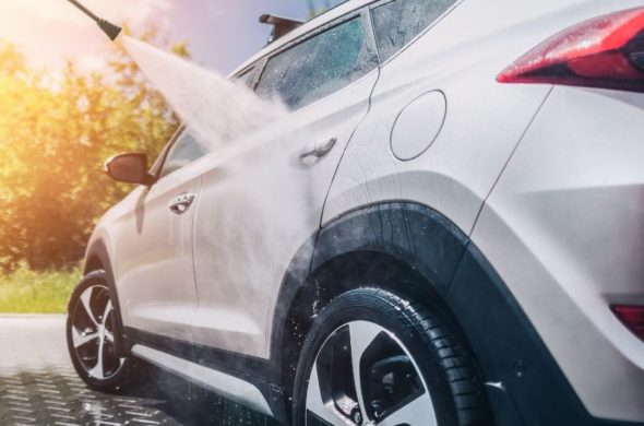 A white SUV getting a car wash