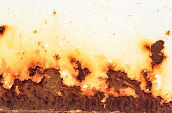 A rusting white car