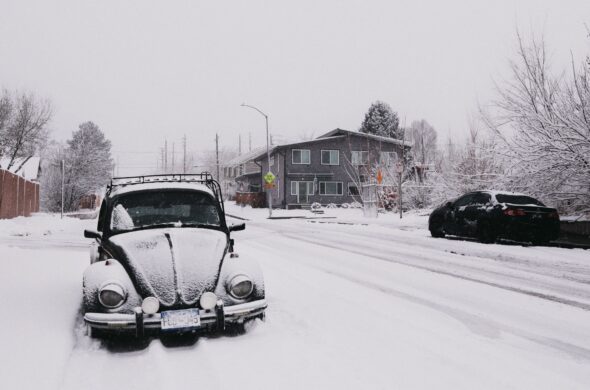 Cars on a snowy street after a storm. Photo by Eduardo Avila Carbajal from Pexels