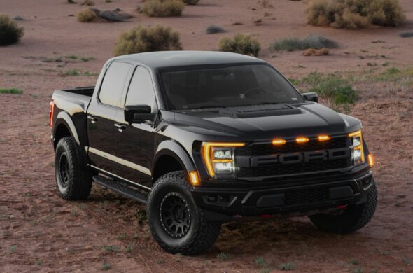 A black Ford F-150 parked in the desert. Photo by Joey Chacon from Unsplash