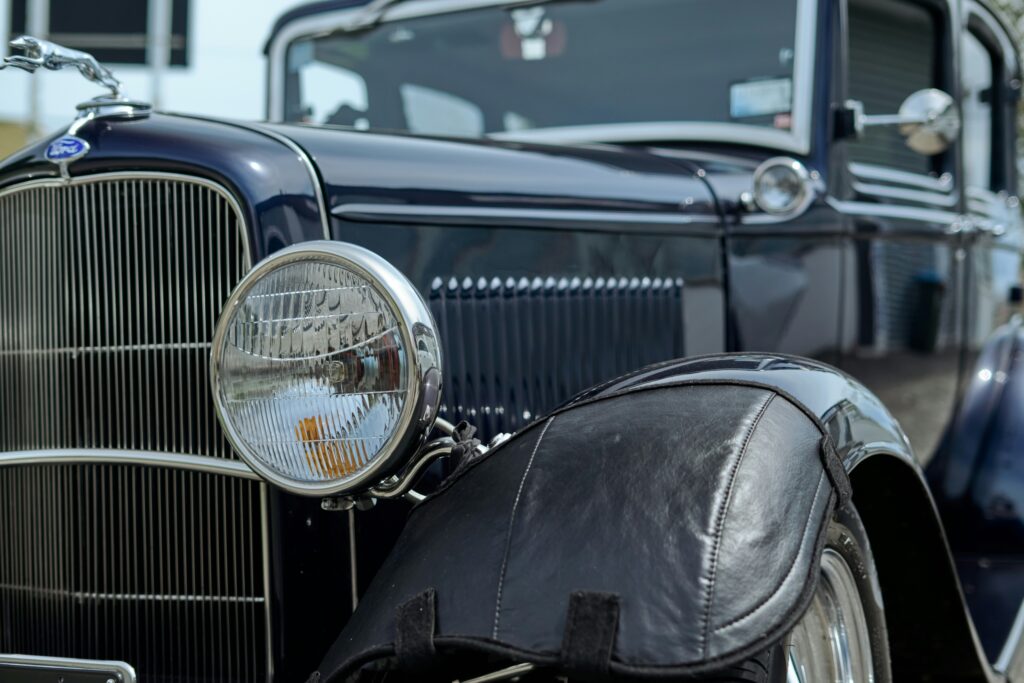 The front of a beautifully restored vintage Ford car. Photo by Gaurav Kumar from Unsplash