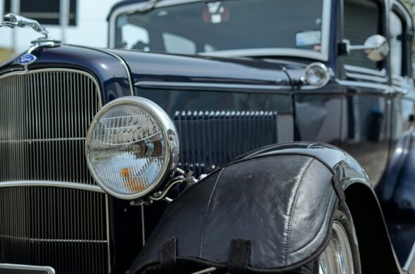 The front of a beautifully restored vintage Ford car. Photo by Gaurav Kumar from Unsplash