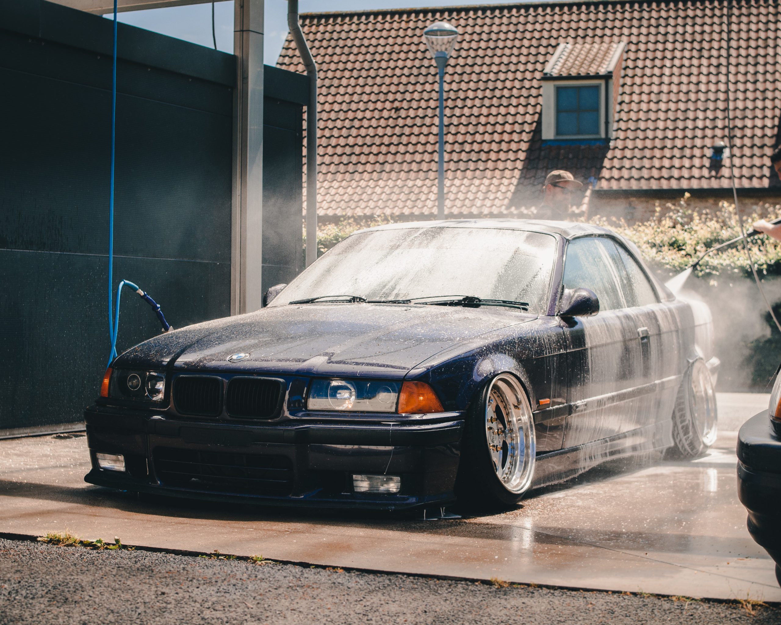 Black BMW being car washed